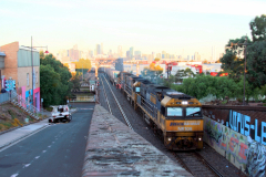 Freight train crossing Maribyrnong River and soon entering Bunbury Street Railway Tunnel