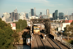 Freight train crossing Maribyrnong River and soon entering Bunbury Street Railway Tunnel